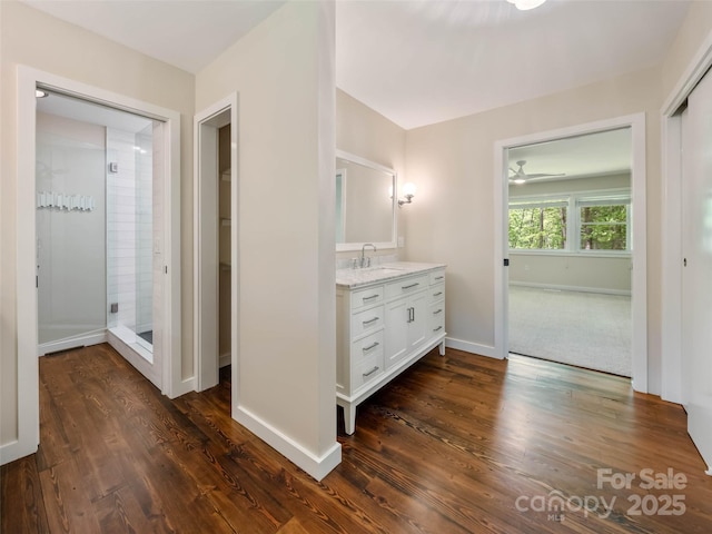 100 Ashton Ln, Brevard, NC 28712 - bathroom with a shower stall, vanity, baseboards, wood finished floors, and ceiling fan