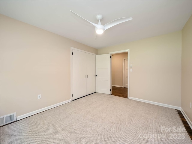 100 Ashton Ln, Brevard, NC 28712 - unfurnished bedroom with carpet, baseboards, and a ceiling fan
