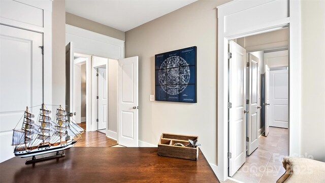 corridor with light wood finished floors