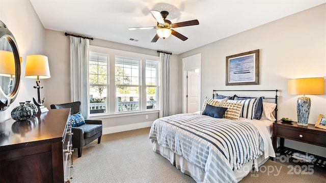 bedroom featuring baseboards, ceiling fan, carpet flooring, and visible vents