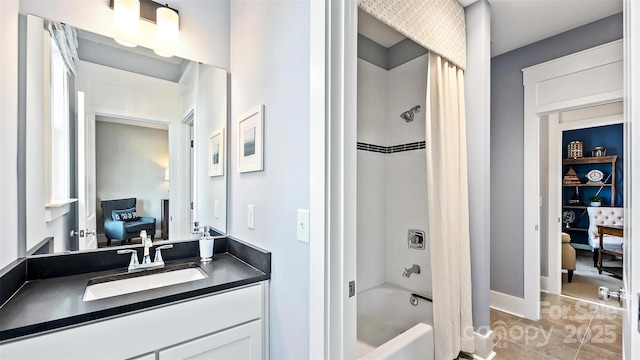 ensuite bathroom with shower / bath combination with curtain, vanity, baseboards, tile patterned floors, and connected bathroom
