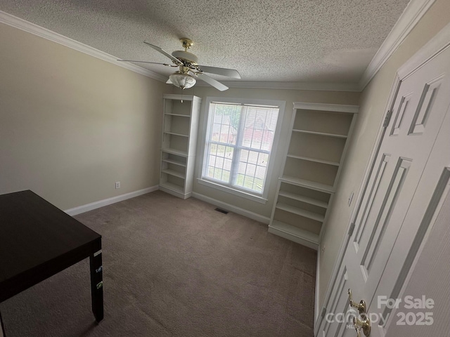interior space with visible vents, carpet flooring, a textured ceiling, and crown molding