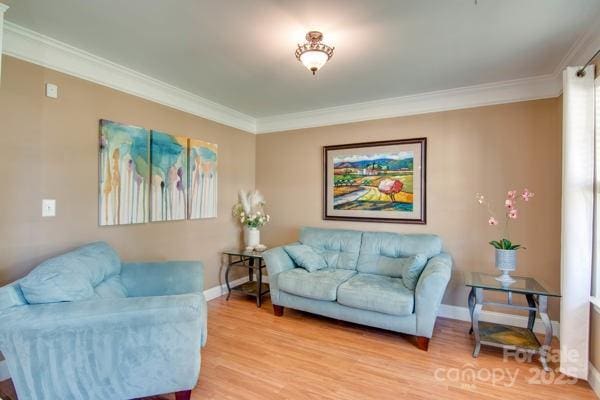 136 Elba Dr, Mooresville, NC 28115 - living room featuring crown molding and light wood-style flooring