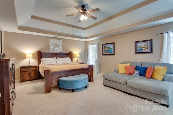 136 Elba Dr, Mooresville, NC 28115 - bedroom featuring a tray ceiling, carpet flooring, and ceiling fan