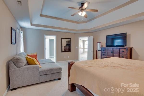 136 Elba Dr, Mooresville, NC 28115 - bedroom featuring a raised ceiling, carpet flooring, and a ceiling fan