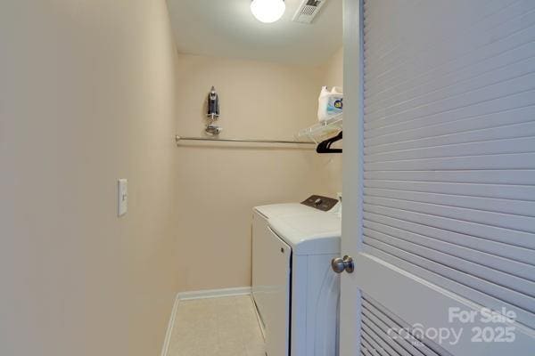 136 Elba Dr, Mooresville, NC 28115 - laundry area with washer and dryer and baseboards