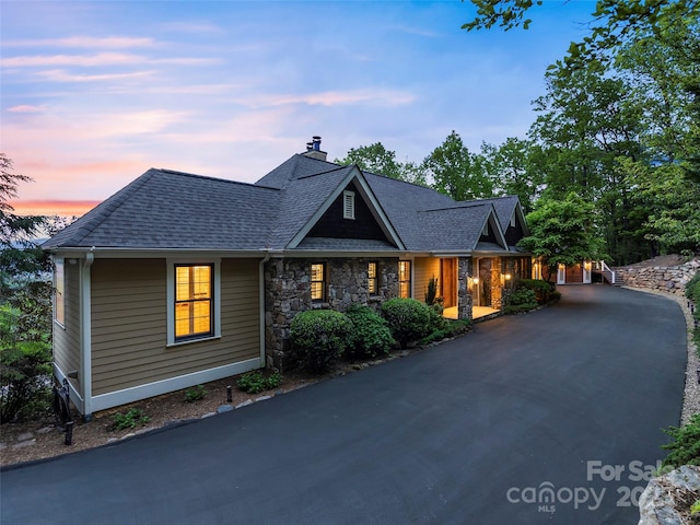 714 Wickhams Fancy Dr, Biltmore Lake, NC 28715 - craftsman inspired home featuring a shingled roof, a chimney, and stone siding