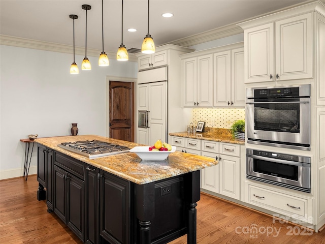 714 Wickhams Fancy Dr, Biltmore Lake, NC 28715 - kitchen with hanging light fixtures, dark cabinets, stainless steel appliances, and ornamental molding