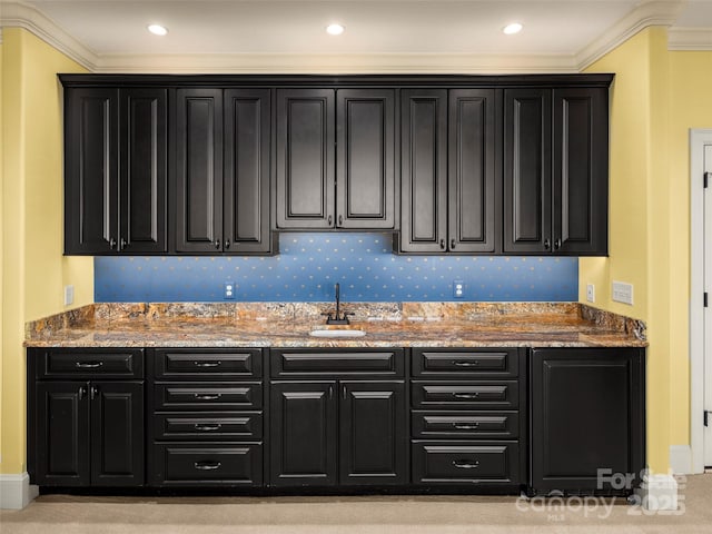 714 Wickhams Fancy Dr, Biltmore Lake, NC 28715 - kitchen with crown molding, light stone counters, and dark cabinetry