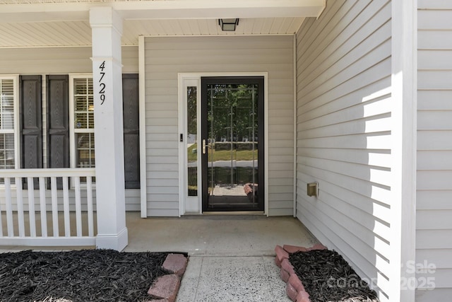 entrance to property with a porch