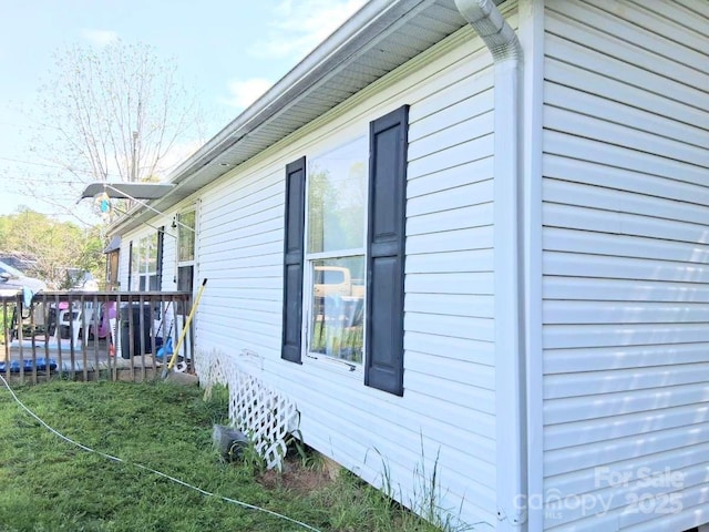 view of home's exterior featuring a deck