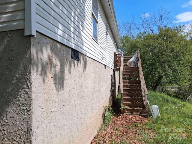 view of property exterior with stairs