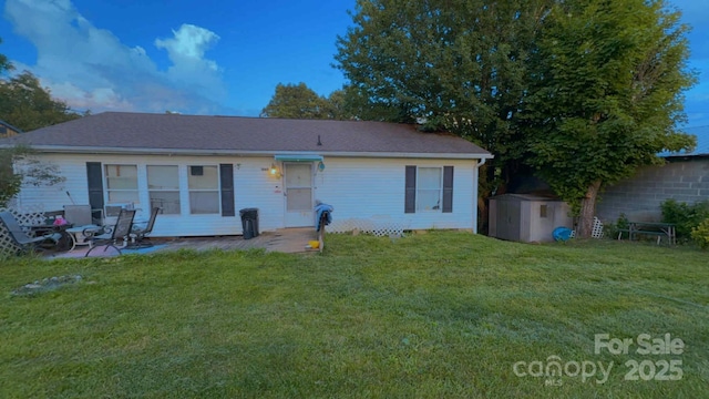 1060 N Canton Rd, Canton, NC 28716 - rear view of house featuring a shed, a lawn, and a patio area