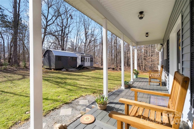view of patio with an outdoor structure and a porch