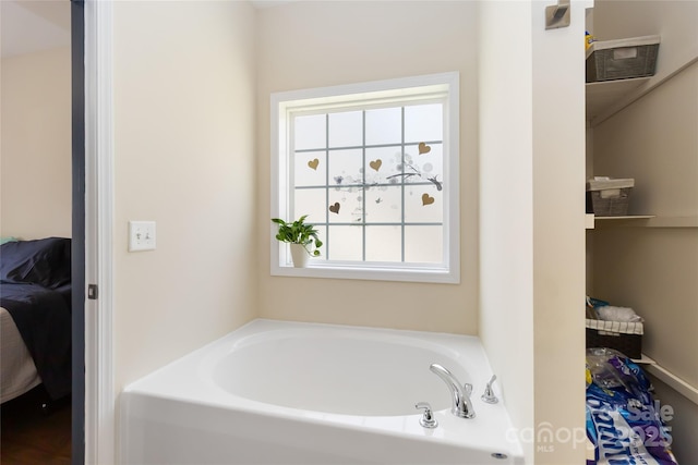 full bathroom with a garden tub and ensuite bath