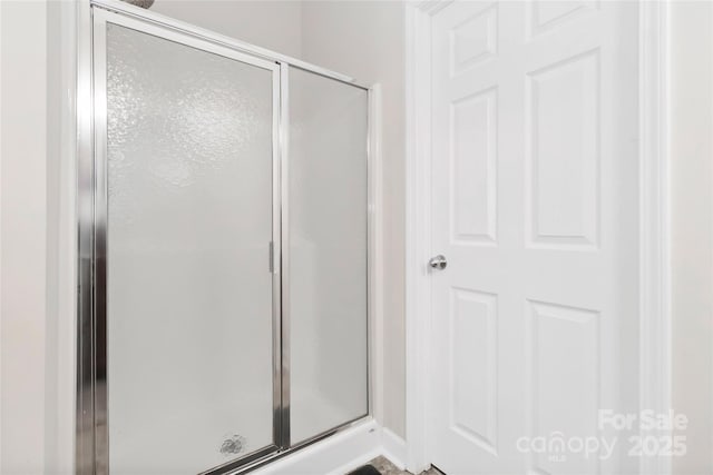 full bathroom featuring a shower stall