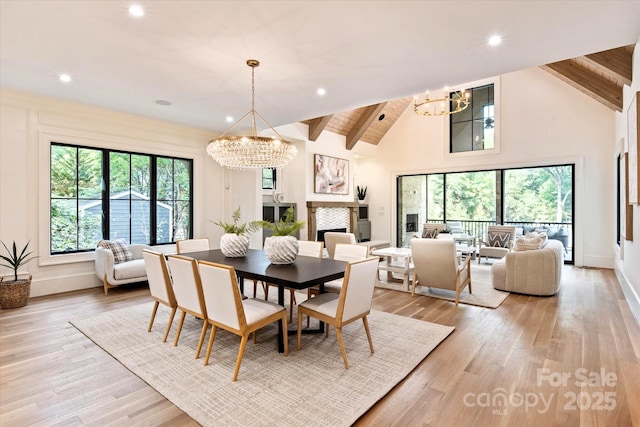 dining space with light wood-style floors, recessed lighting, and a chandelier