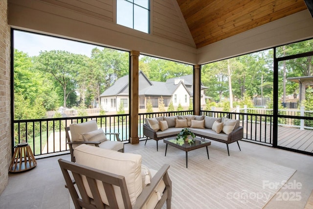 sunroom with outdoor lounge area and a residential view
