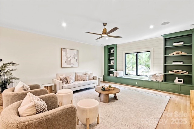 living room with recessed lighting, ceiling fan, and wood finished floors