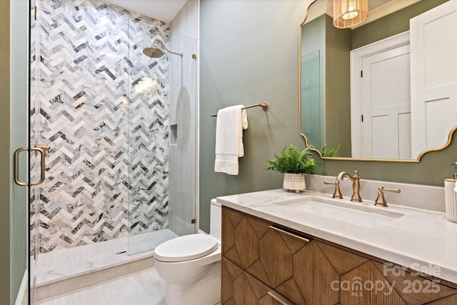 full bathroom with vanity, tile patterned floors, a shower stall, and toilet