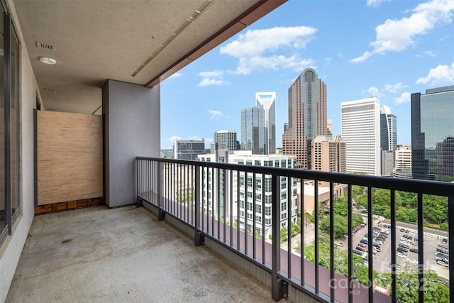 balcony featuring a view of city and visible vents