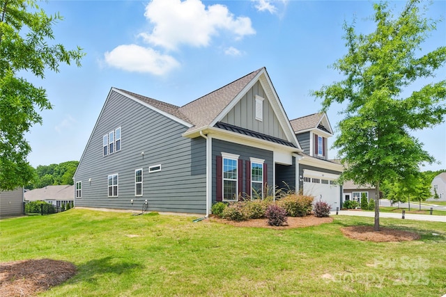 4069 Havenport Cir, Tega Cay, SC 29708 - view of property exterior featuring board and batten siding, concrete driveway, a lawn, and a standing seam roof