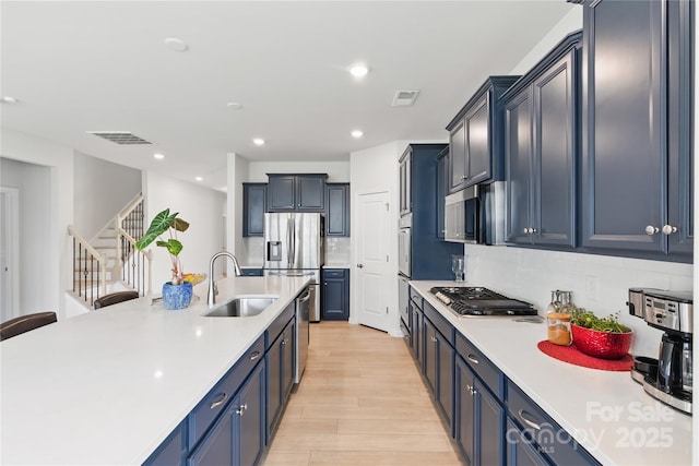 4069 Havenport Cir, Tega Cay, SC 29708 - kitchen with a sink, appliances with stainless steel finishes, light countertops, backsplash, and recessed lighting