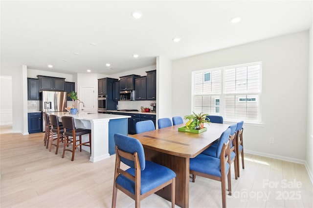 4069 Havenport Cir, Tega Cay, SC 29708 - dining room with light wood-type flooring, recessed lighting, and baseboards