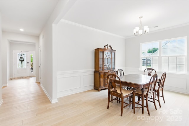 4069 Havenport Cir, Tega Cay, SC 29708 - dining space with a chandelier, light wood-style flooring, a wainscoted wall, recessed lighting, and ornamental molding