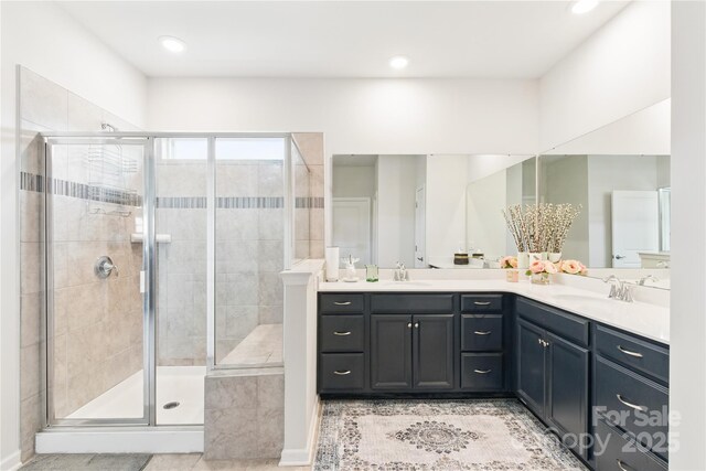 4069 Havenport Cir, Tega Cay, SC 29708 - full bathroom with double vanity, a stall shower, tile patterned flooring, and recessed lighting