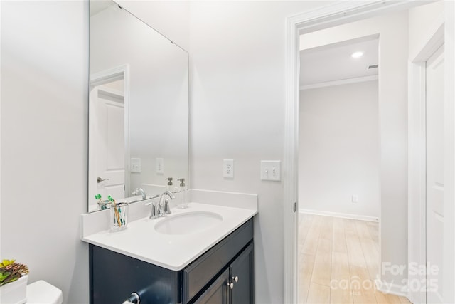 4069 Havenport Cir, Tega Cay, SC 29708 - bathroom with vanity, toilet, crown molding, and wood finished floors