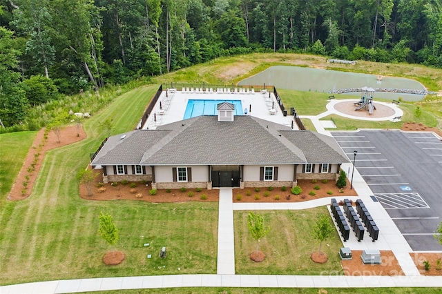 4069 Havenport Cir, Tega Cay, SC 29708 - view of subject property featuring a forest, a pool area, and a nearby body of water