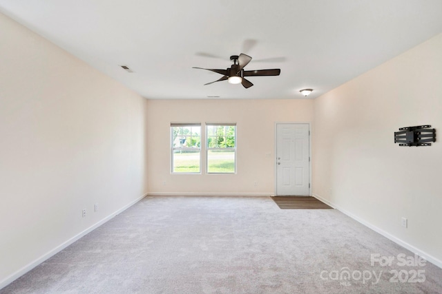 1175 Valley St Unit 111, Statesville, NC 28677 - spare room featuring carpet, visible vents, baseboards, and ceiling fan