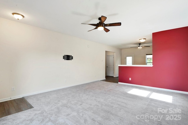 1175 Valley St Unit 111, Statesville, NC 28677 - empty room featuring baseboards, dark colored carpet, and ceiling fan