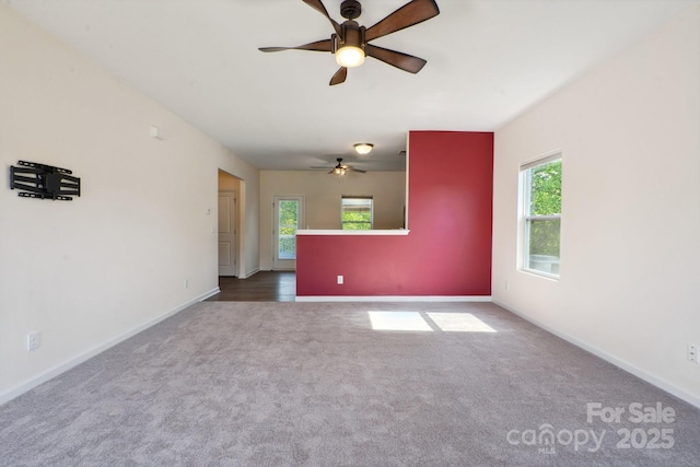 1175 Valley St Unit 111, Statesville, NC 28677 - unfurnished room with plenty of natural light, baseboards, ceiling fan, and carpet floors