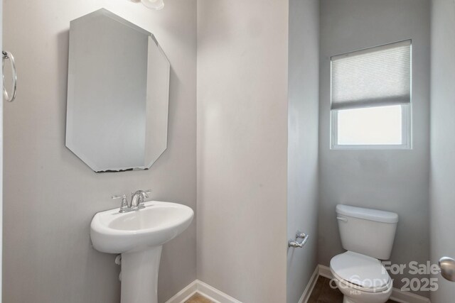 1175 Valley St Unit 111, Statesville, NC 28677 - half bathroom with toilet, baseboards, and a sink