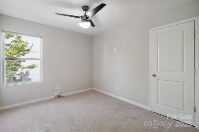 1175 Valley St Unit 111, Statesville, NC 28677 - carpeted empty room with baseboards and a ceiling fan