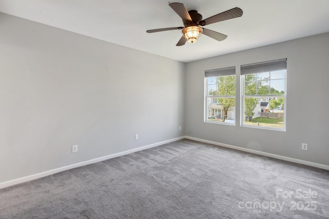 1175 Valley St Unit 111, Statesville, NC 28677 - spare room featuring carpet, baseboards, and a ceiling fan