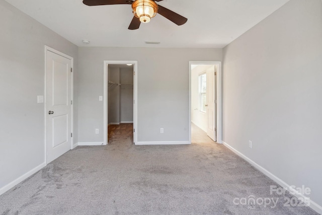 1175 Valley St Unit 111, Statesville, NC 28677 - unfurnished bedroom featuring baseboards, a spacious closet, a closet, and carpet floors