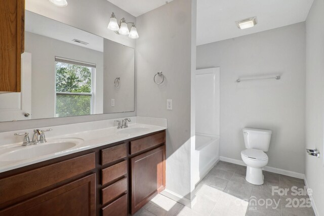 1175 Valley St Unit 111, Statesville, NC 28677 - bathroom with toilet, visible vents, a sink, and double vanity