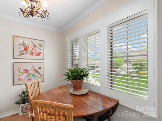 671 S Haywood St Unit 108B, Waynesville, NC 28786 - dining space with baseboards, ornamental molding, and a notable chandelier