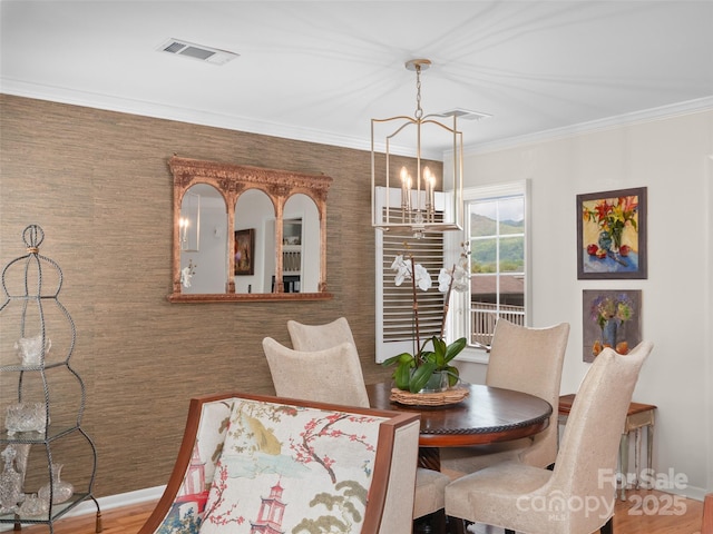 671 S Haywood St Unit 108B, Waynesville, NC 28786 - dining area with an inviting chandelier, baseboards, crown molding, and visible vents