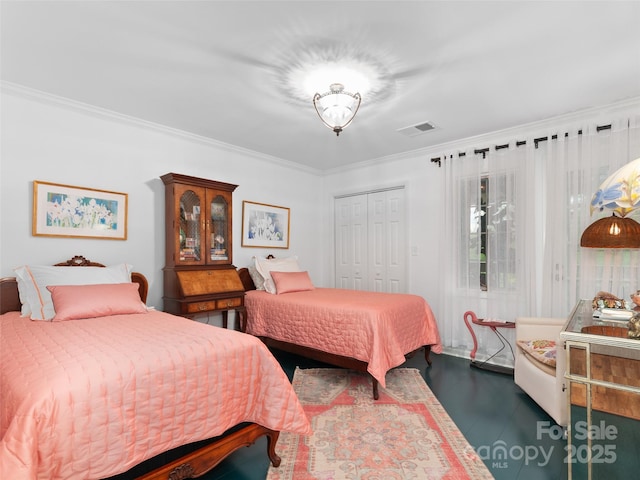 671 S Haywood St Unit 108B, Waynesville, NC 28786 - bedroom featuring visible vents, ornamental molding, wood finished floors, and a closet