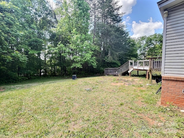 view of yard featuring a wooden deck