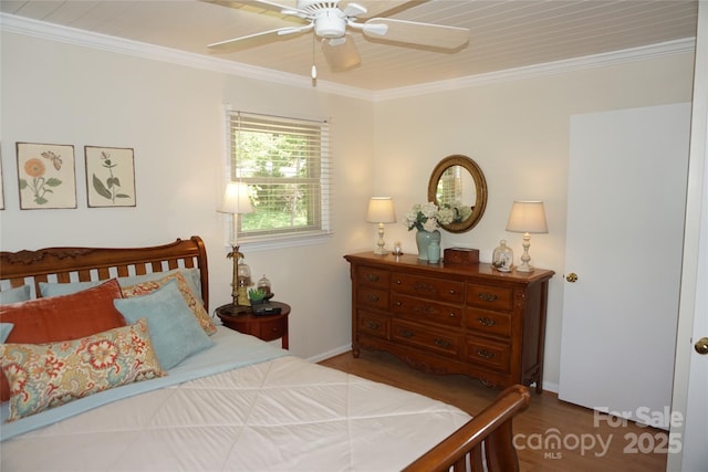 bedroom with ornamental molding, ceiling fan, and wood finished floors