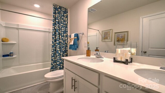 103 Eleanor Cove Rd, Arden, NC 28704 - bathroom featuring double vanity, toilet, visible vents, and a sink