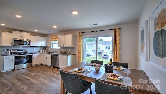 103 Eleanor Cove Rd, Arden, NC 28704 - kitchen featuring white cabinets, recessed lighting, appliances with stainless steel finishes, and dark wood-style floors