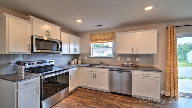 103 Eleanor Cove Rd, Arden, NC 28704 - kitchen with white cabinetry, stainless steel appliances, dark wood-type flooring, and a sink