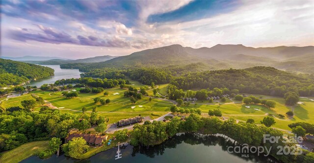 aerial view at dusk of a water and mountain view