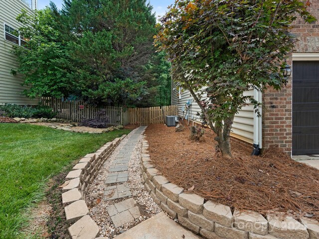 3721 Providence Plantation Ln, Charlotte, NC 28270 - view of yard featuring a garage and central AC unit